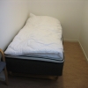 very small room, only have 1 bed and 1 chair, no curtains in window to dark room from sun and light.