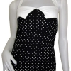 Svart polka dots linne med vita prickar. Den har ett markerande vitt band ovanför bysten och ett justerbart halsterneck band av färgen vit. 
Finns i storlekarna XS-L
199 kr