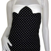 Svart polka dots linne med vita prickar. Den har ett markerande vitt band ovanför bysten och ett justerbart halsterneck band av färgen vit. 
Finns i storlekarna XS-L
Pris: 199 kr