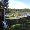 View from behind, with the water and our sunchairs which our customers can borrow while eating.