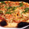 One of the pizzas that we make today - marinated octopus, scallop, chili oil and wakame seaweed.