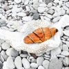 Bild från Fridhem, Visby, Gotland av @mosebacke - Croissant på stenstranden 