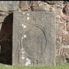 Gravhäll bevarad i Västra Eds kyrkoruin. Sven Jönsson d1745 med maka Karin Larsdotter d1759 Vråka.. 