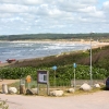  Vy över stranden, till höger livräddningsskolan.