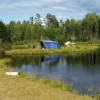 The island Jersey  in the group of Hätteboda Cannel Islands. Are they digging down something there in side the tent??