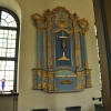 Den tidigare altaruppsatsen från 1758 sitter nu på norra väggen