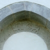 Denna igenmurade portal från 1100-talets slut har tillhört den äldre kyrkobyggnaden.