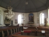 Altartavlan av John Hedaeus är från 1931 och föreställer Jesu bergspredikan.