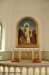 Altartavlan är målad av Ludvig Frid efter ett original av Carl Bloch