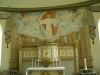 Predikstolen ovanför altaret och David Ralssons kormålning från 1963