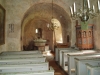 Bakom altaret i absiden syns trappan
