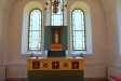 Altarskåp med Kristus som centralfigur hållande världsklotet