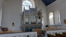 Orgeln står i norra sidoskeppet.