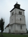 Ett torn med vidhängande kyrka.